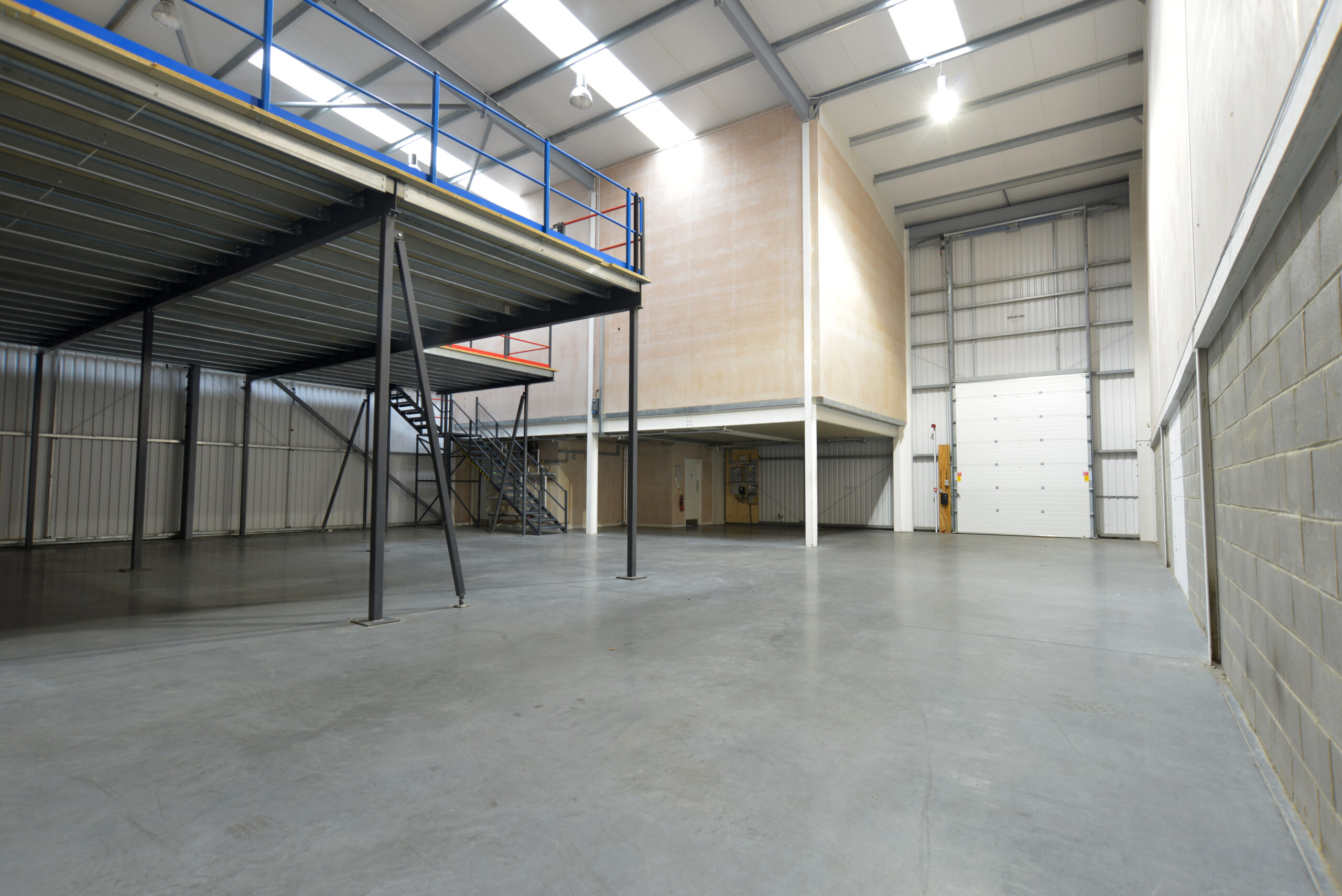 Empty steel-framed warehouse interior
