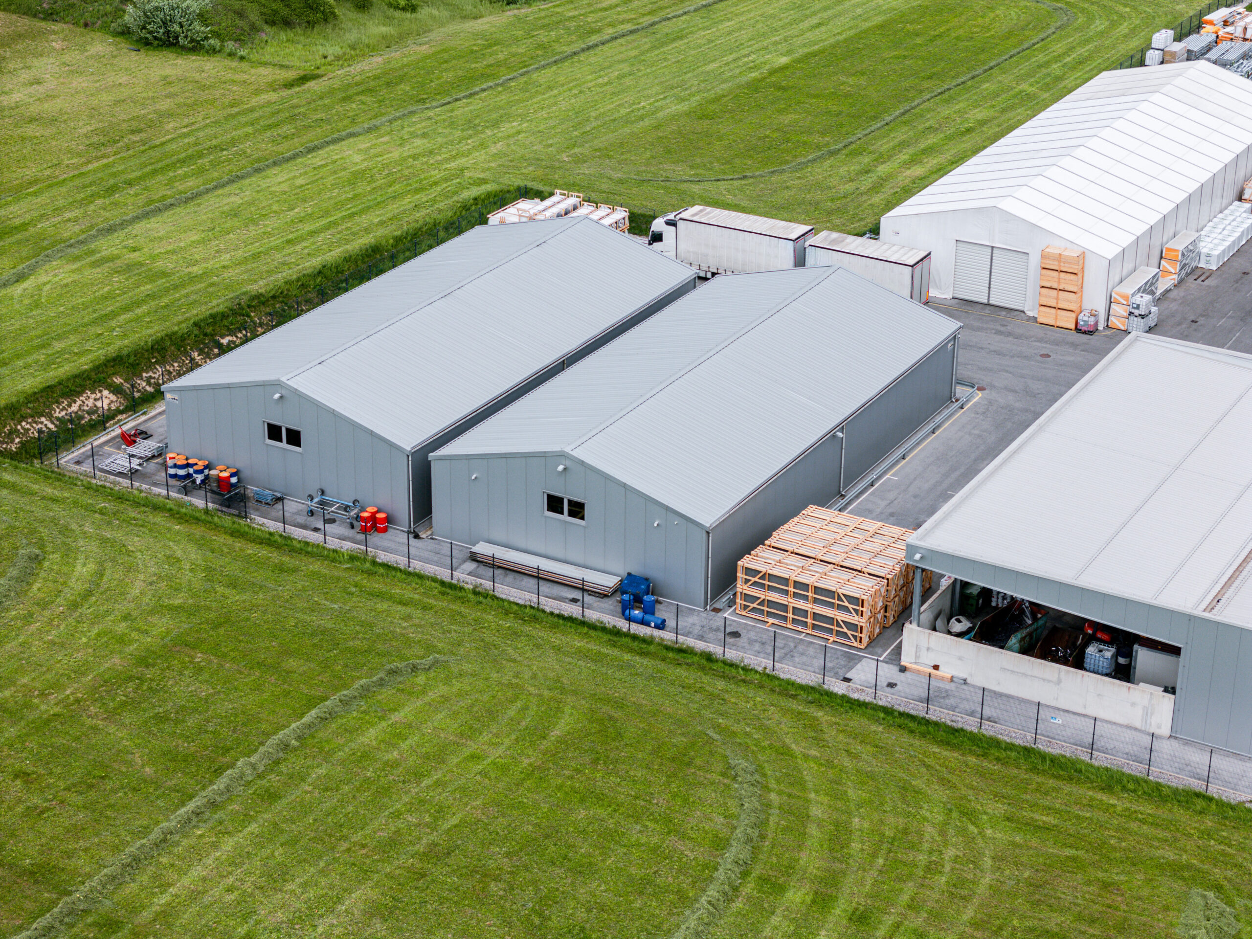 Aerial View of Industrial Buildings in a Green Landscape